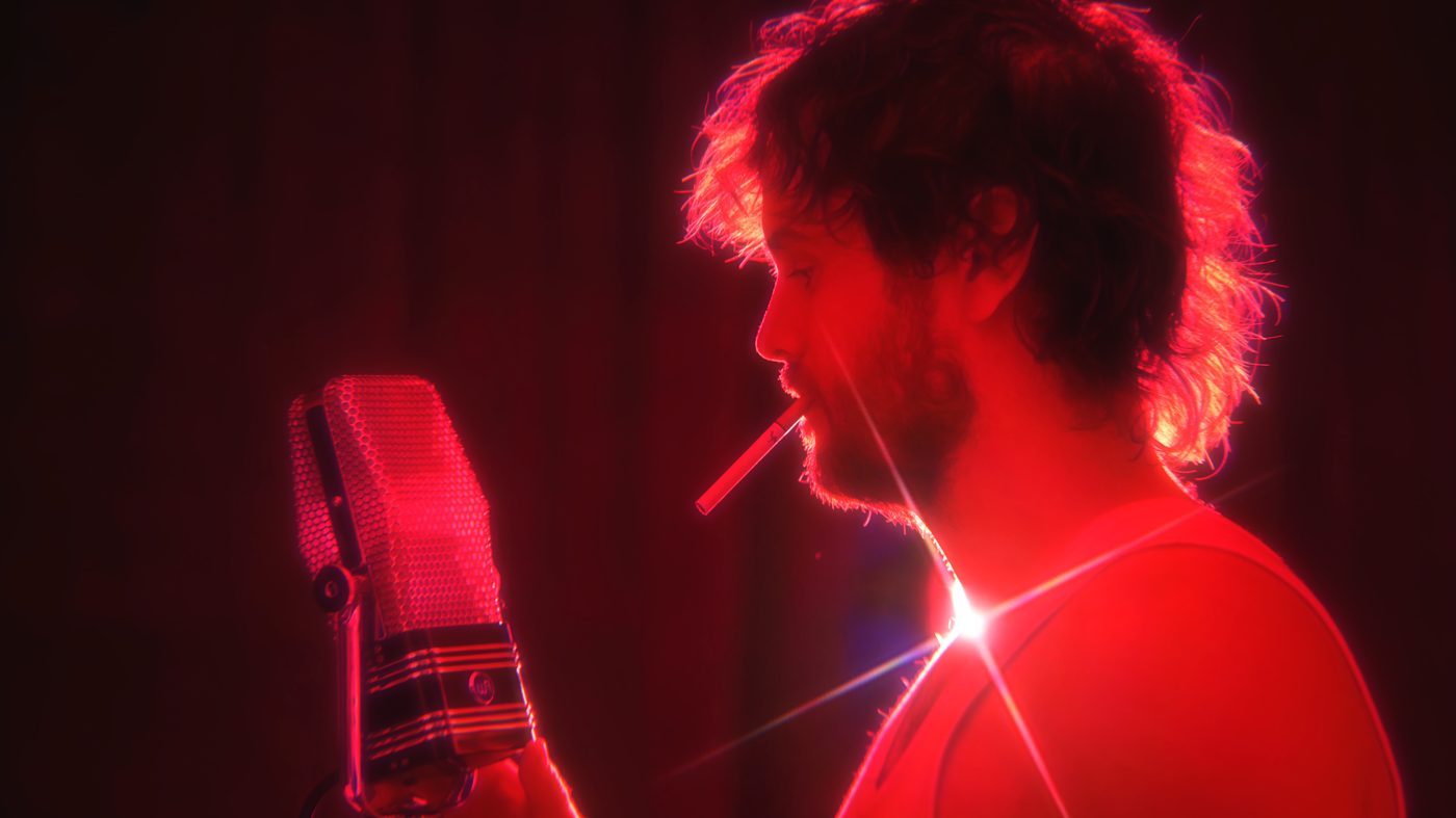 Simon performing with guitar